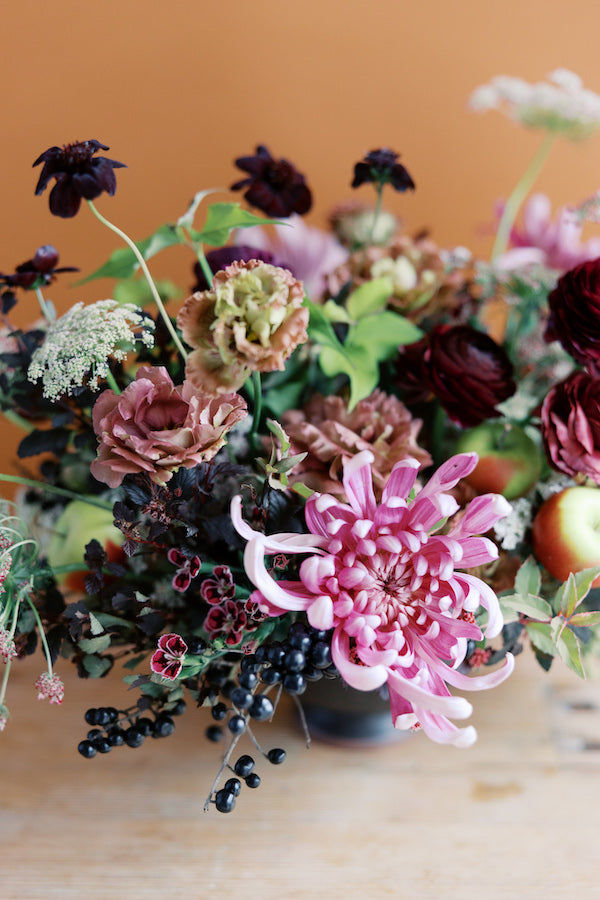 deep purple thanksgiving centerpiece by seascape flowers local florist