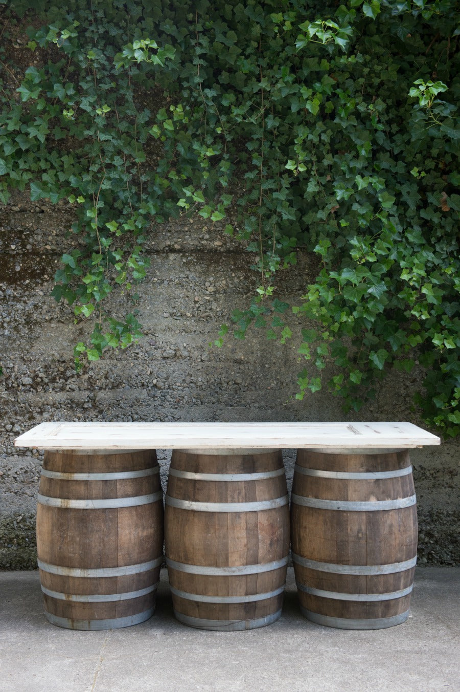 wine barrel bar with a reclaimed door top